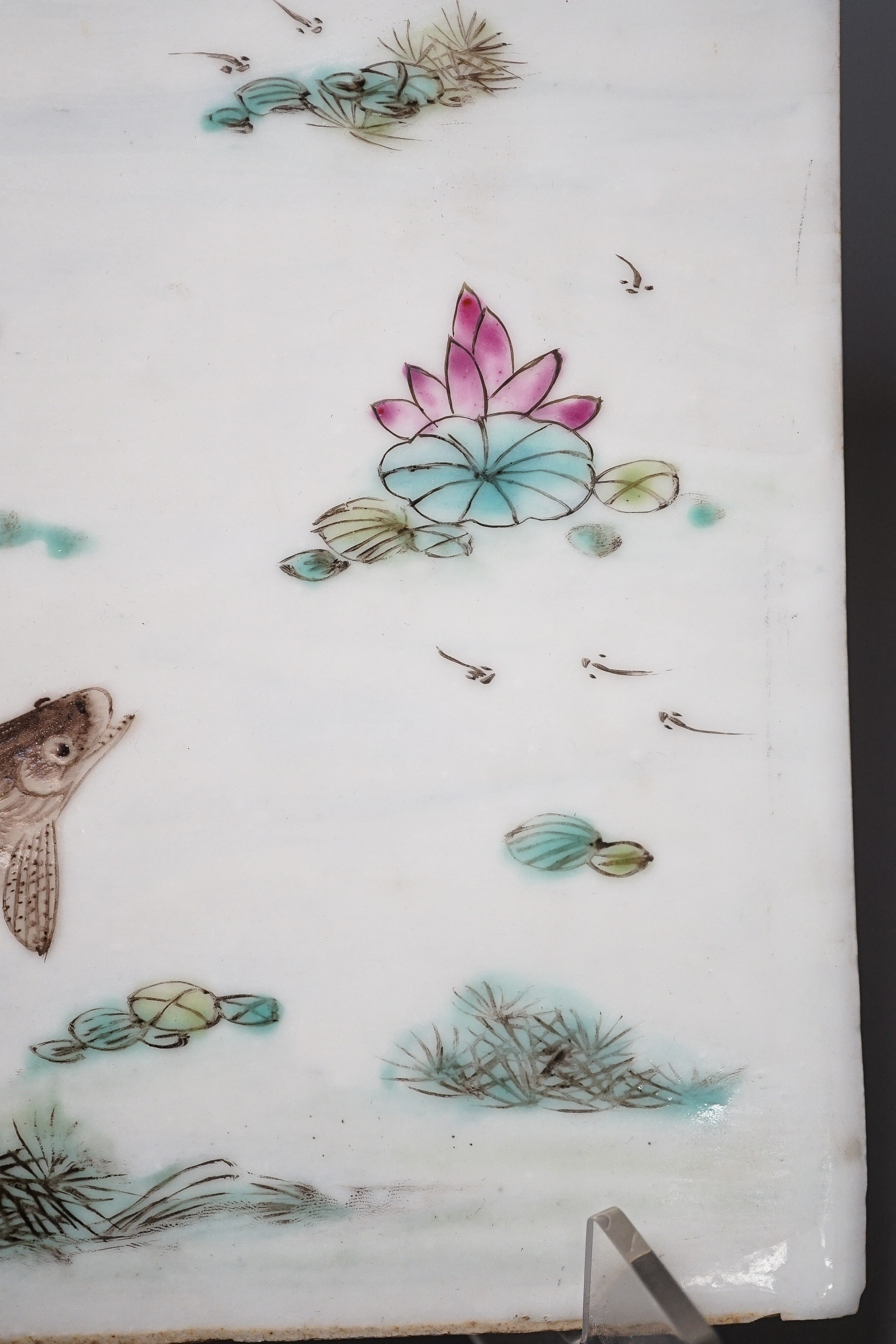 A Chinese famille rose porcelain rectangular plaque, Republic period (1912-49), painted with fish in a pond amid weed and inscribed upper left 36.5x25.5cm
